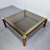 FEDAM BURGUNDY AND GOLD COFFEE TABLE